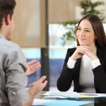 Businesswoman attending a client at office